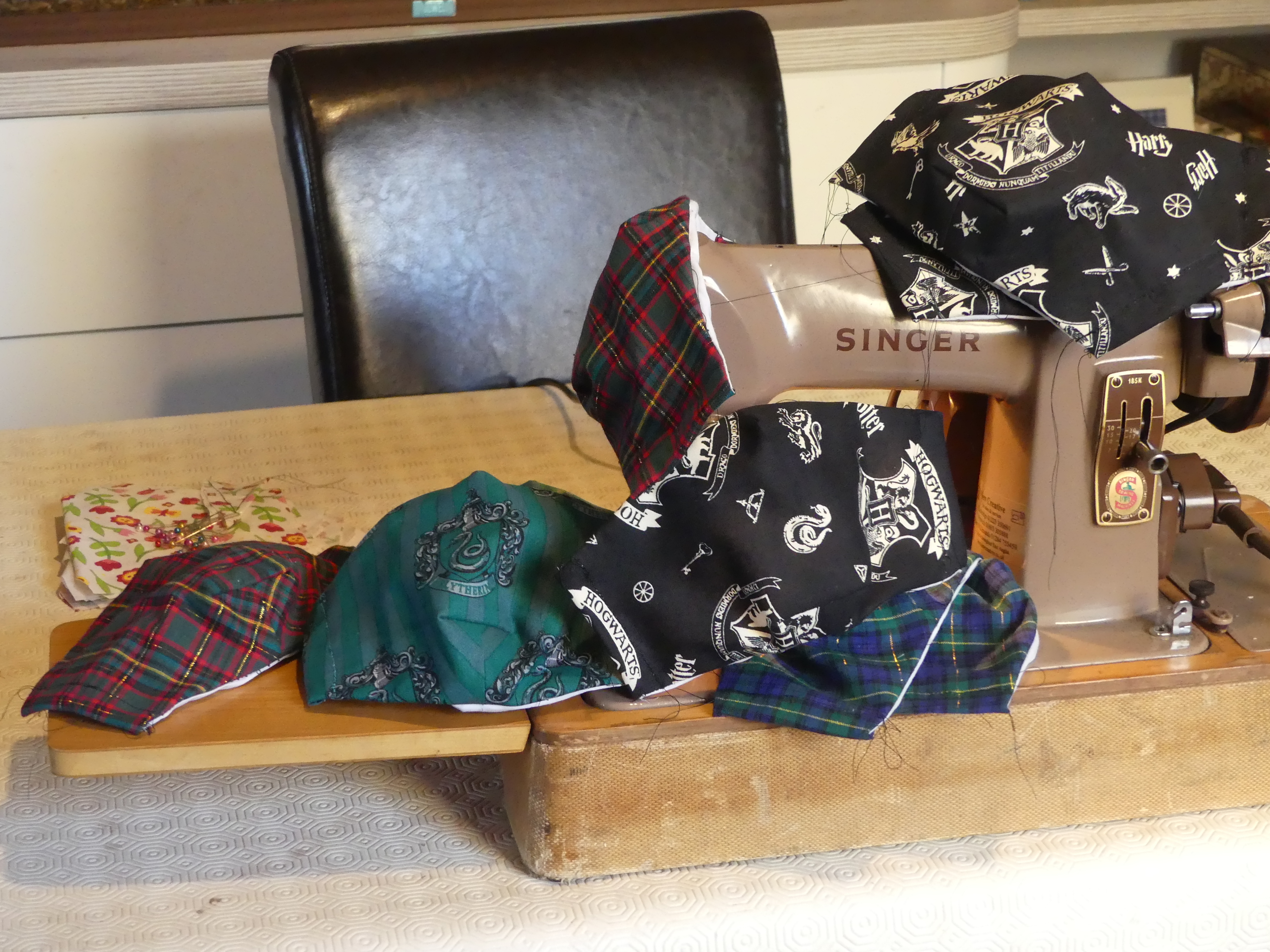 Covid-19 masks draped over a sewing machine