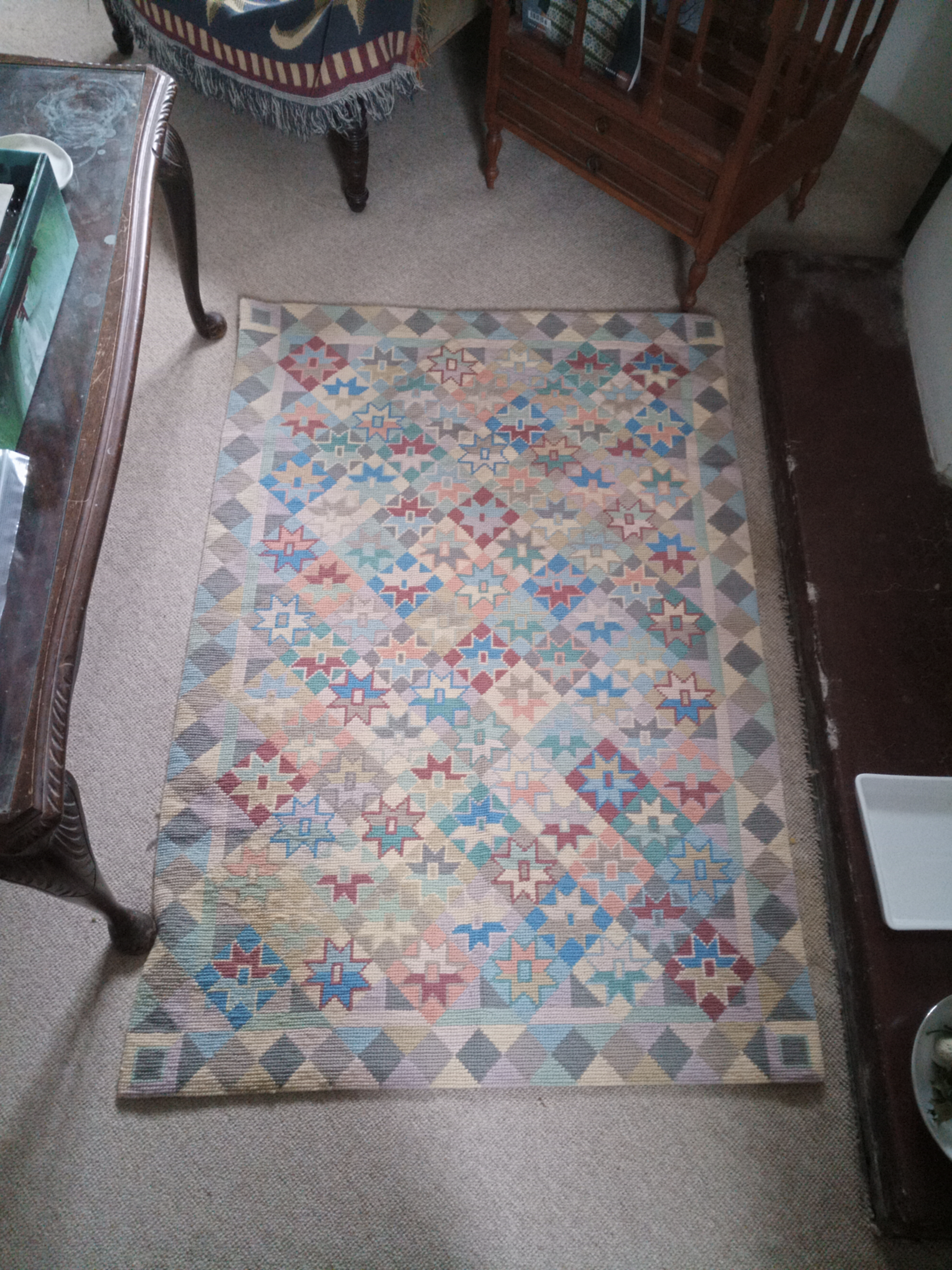 Cross-stitch rug, designed by Kaffe Fassett, sold by Ehrman